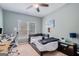 Bright bedroom with a built-in workspace and window at 1390 Turtle Dove Ln, Lawrenceville, GA 30043