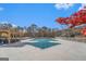 Community pool with safety cover and covered seating area at 1390 Turtle Dove Ln, Lawrenceville, GA 30043