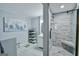 Modern bathroom with walk-in shower and tiled walls at 5997 Wildcreek Rd, Sugar Hill, GA 30518