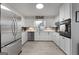 Modern kitchen featuring stainless steel appliances and white cabinetry at 60 Woodruff St, Mcdonough, GA 30253