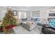 Cozy living room featuring sectional sofa and Christmas tree at 308 Lee Thompson Rd, Moreland, GA 30259