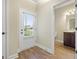 Front entry with white door, wood-look floors, and adjacent half bathroom at 2275 Lovejoy Rd # 72, Hampton, GA 30228