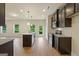 Kitchen with dark brown cabinets, granite counters, and island at 2275 Lovejoy Rd # 72, Hampton, GA 30228