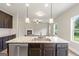 Kitchen island with sink, dishwasher, and view into living room at 2275 Lovejoy Rd # 72, Hampton, GA 30228