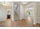 Bright landing with staircase, half bathroom, and view into living room at 2275 Lovejoy Rd # 72, Hampton, GA 30228