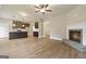 Open living room with fireplace and view into kitchen and dining areas at 2275 Lovejoy Rd # 72, Hampton, GA 30228