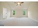 Large main bedroom with ceiling fan and two windows at 2275 Lovejoy Rd # 72, Hampton, GA 30228