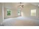 Main bedroom with ceiling fan and multiple windows at 2275 Lovejoy Rd # 72, Hampton, GA 30228