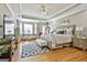 Spacious main bedroom with king-size bed and sitting area at 395 W Mcintosh Rd, Brooks, GA 30205