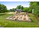 Aerial view of a property with a barn, garden, and silo at 238 Indian Creek Rd, Locust Grove, GA 30248