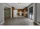 Kitchen with wood cabinets, white appliances, and tiled floor at 4378 Ridge Ct, Loganville, GA 30052