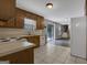 Kitchen with wood cabinets, white appliances, and sliding glass door to deck at 4378 Ridge Ct, Loganville, GA 30052