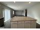 Kitchen island with granite countertops and white cabinets at 846 Delft Way, Hampton, GA 30228