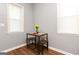 Small dining area with a table and three stools at 112 Parson St, Bowdon, GA 30108