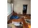 Living room with hardwood floors, a chair, and cluttered floor at 43 Thurman Rd, Stockbridge, GA 30281