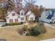 Two-story house with red roof and shutters, landscaping, and driveway at 125 Blackjack Ct, Fayetteville, GA 30215