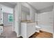 Bathroom with granite countertop, white cabinets, and a bathtub at 5374 Tolar Rd # 79, South Fulton, GA 30213