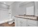 Bathroom with granite countertop, white cabinets, and shower/tub combo at 5374 Tolar Rd # 79, South Fulton, GA 30213