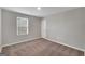 Bright bedroom with carpeted floor, neutral walls, and window with blinds at 5374 Tolar Rd # 79, South Fulton, GA 30213