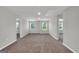 Large bonus room with carpet, two windows, and access to bedrooms at 5374 Tolar Rd # 79, South Fulton, GA 30213