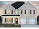 Two-story house with gray brick, dark gray roof, and white accents at 5374 Tolar Rd # 79, South Fulton, GA 30213