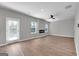 Gathering room with hardwood floors, fireplace, and door to outside at 5374 Tolar Rd # 79, South Fulton, GA 30213