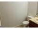 Small bathroom with toilet and vanity at 7978 Woodlake Dr, Riverdale, GA 30274