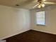 Bedroom with carpet flooring and ceiling fan at 7978 Woodlake Dr, Riverdale, GA 30274