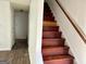 Wood staircase leading to the upper level of the home at 7978 Woodlake Dr, Riverdale, GA 30274
