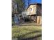 Side view of the home, showing stairs and deck at 1000 Tanglewood Tl, Woodstock, GA 30189