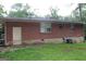 Brick house exterior with a back door and AC unit at 126 E Mimosa Dr, Jonesboro, GA 30236