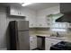 Kitchen with stainless steel appliances and ample cabinet space at 126 E Mimosa Dr, Jonesboro, GA 30236