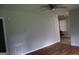 Bright living room featuring hardwood floors and a ceiling fan at 126 E Mimosa Dr, Jonesboro, GA 30236