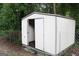 White storage shed with double doors at 126 E Mimosa Dr, Jonesboro, GA 30236