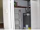 Utility room with water heater and shelving at 126 E Mimosa Dr, Jonesboro, GA 30236