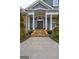 Elegant home exterior featuring a grand entrance with stone steps and columns at 1064 Highway 20 E, Mcdonough, GA 30252