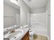 Bathroom includes a vanity, toilet and shower/tub combo at 231 Ferguson Ave, Locust Grove, GA 30248