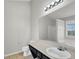 Bathroom features a vanity, toilet, and shower/tub combo at 231 Ferguson Ave, Locust Grove, GA 30248