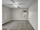 Well-lit bedroom with ceiling fan and window at 231 Ferguson Ave, Locust Grove, GA 30248