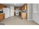Simple kitchen with light wood cabinets and white appliances at 231 Ferguson Ave, Locust Grove, GA 30248