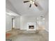 Living room featuring a fireplace and vaulted ceiling at 231 Ferguson Ave, Locust Grove, GA 30248