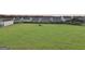 Large grassy lot ready for new construction, surrounded by established homes at 231 Ferguson Ave, Locust Grove, GA 30248