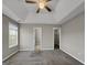 Main bedroom with carpet, ceiling fan, and access to bathroom and closet at 231 Ferguson Ave, Locust Grove, GA 30248