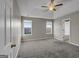 Spacious main bedroom with carpet flooring and ceiling fan at 231 Ferguson Ave, Locust Grove, GA 30248