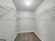 Spacious walk-in closet with wire shelving provides ample storage at 231 Ferguson Ave, Locust Grove, GA 30248