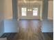 Bright dining room with hardwood floors and elegant light fixture at 485 Oxford Crest Ct, Lawrenceville, GA 30043