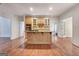 Bright kitchen with island, stainless steel appliances, and hardwood floors at 307 Bradford Way, Peachtree City, GA 30269