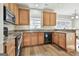 Eat-in kitchen with granite countertops and wood cabinets at 409 St Dunstans Ct, Peachtree City, GA 30269