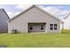 Covered patio with gray siding and green lawn at 139 Avondale Blvd, Conyers, GA 30013