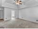 Bedroom with access to bathroom and ceiling fan at 93 Lakesprings Dr, Mcdonough, GA 30252